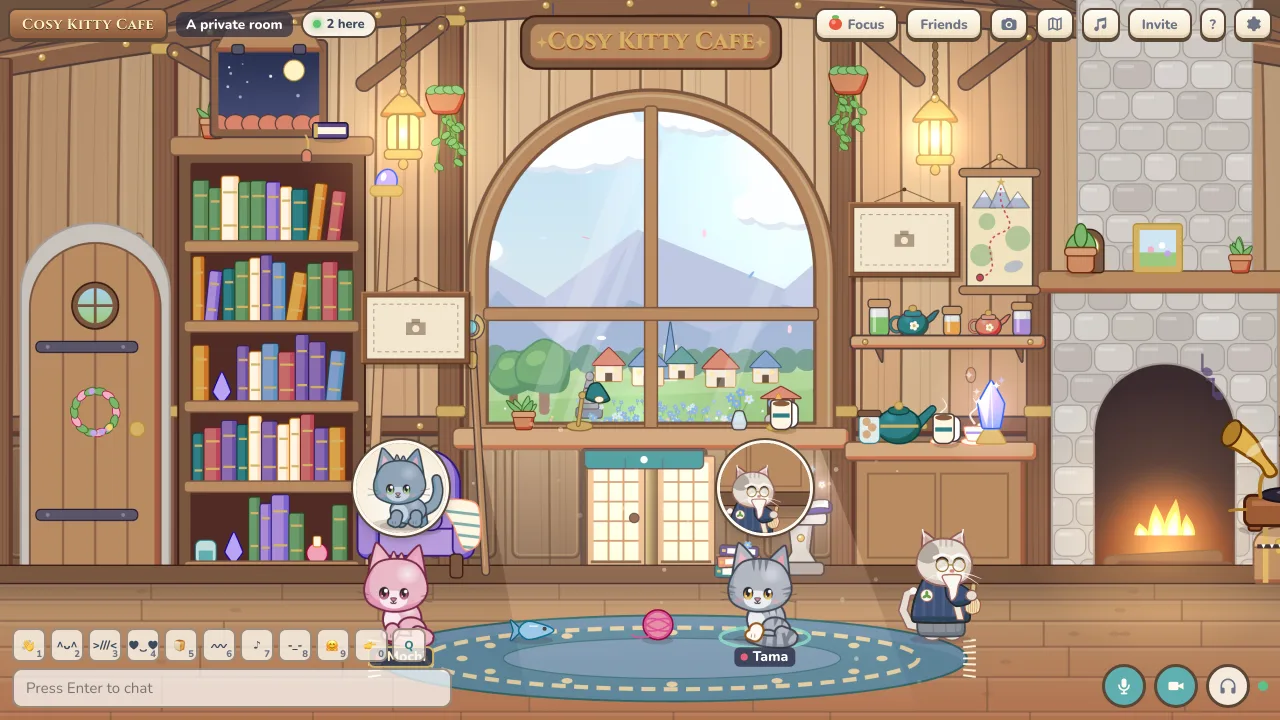 Two cats in a private room, each with a webcam bubble above them, and the mic and camera buttons on